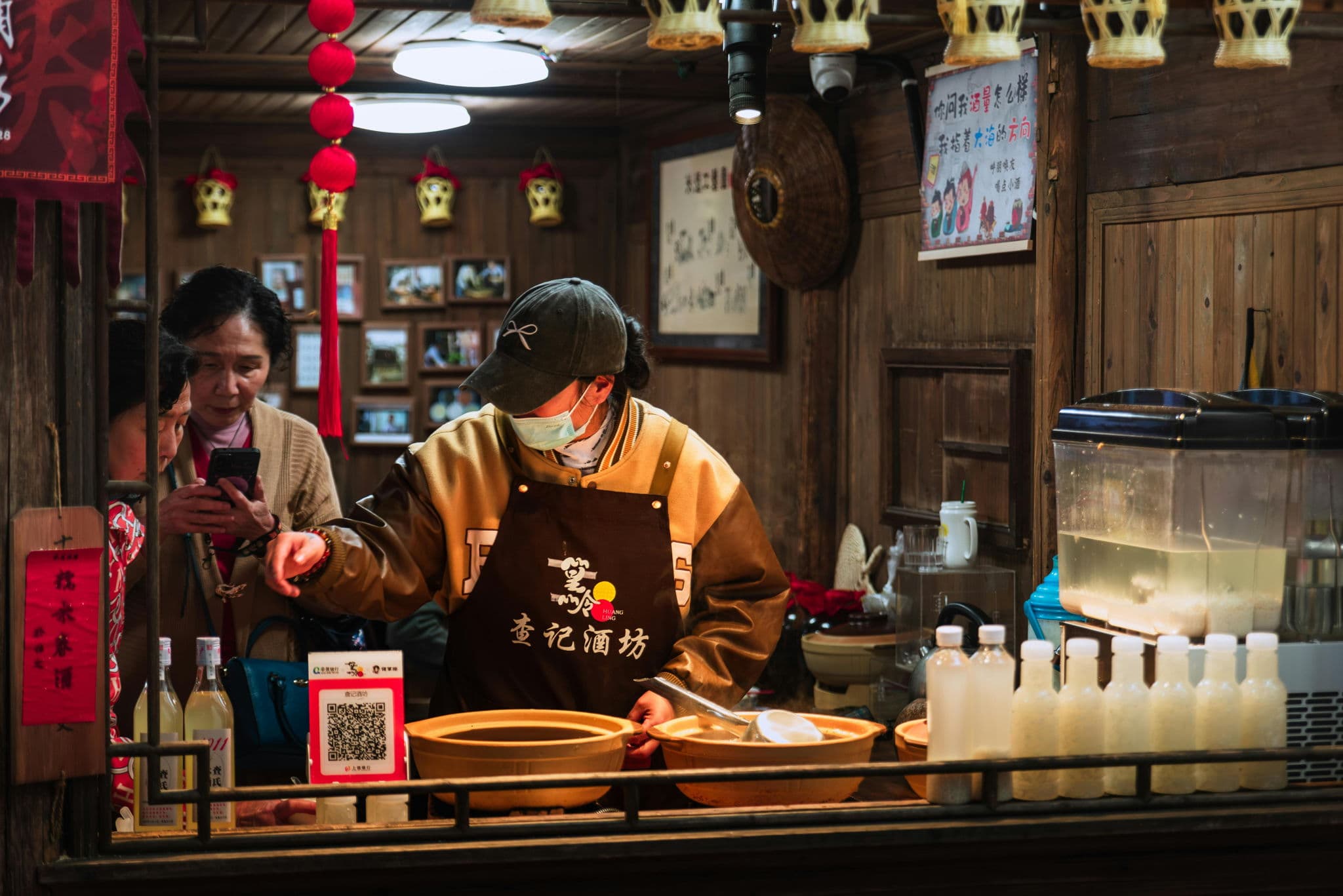Restaurant owner welcoming guests at the table, the first step in building a customer growth loop
